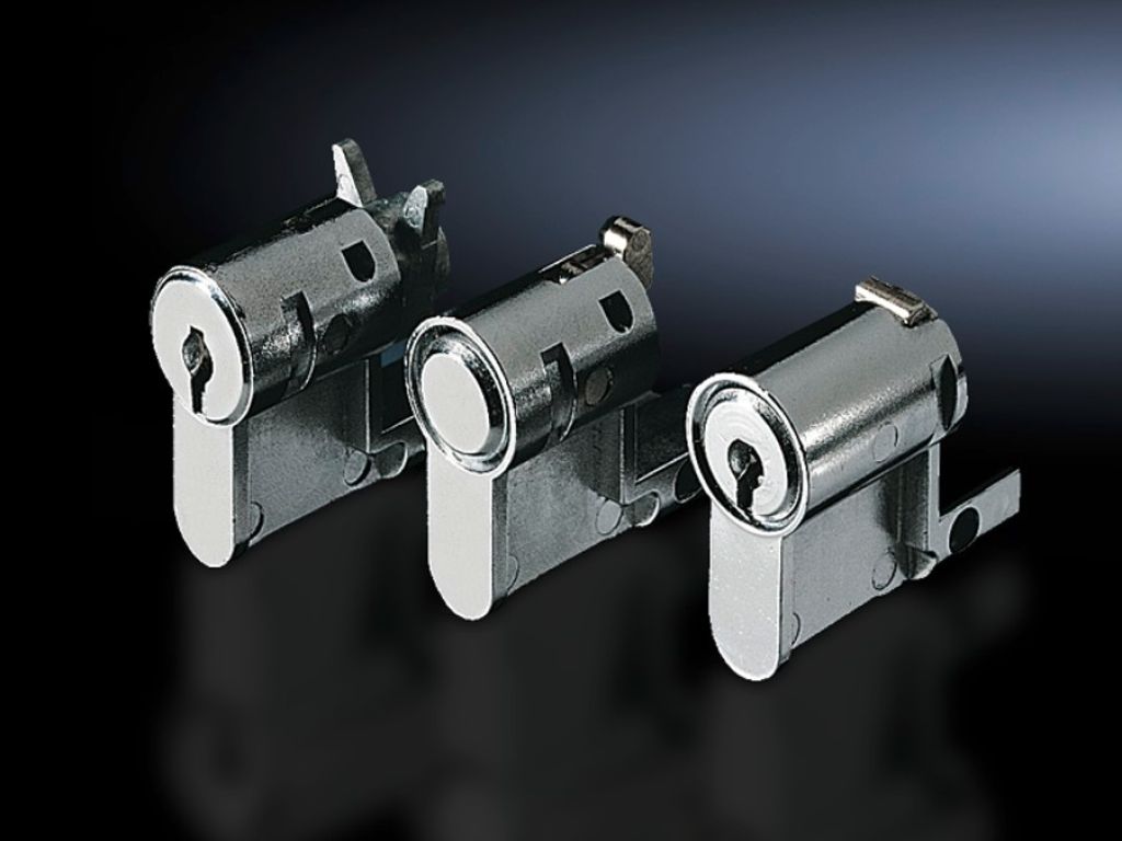 Lock and push-button inserts and profile half-cylinders do systemu uchwytów